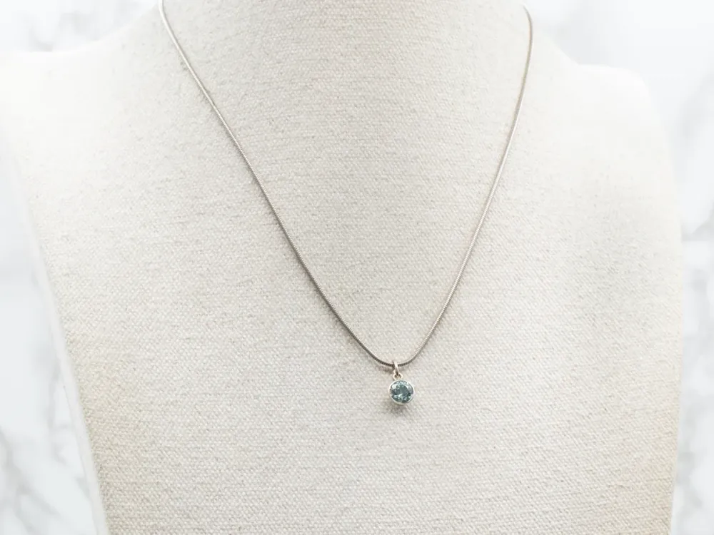 Bezel Set Aquamarine Solitaire Pendant Spaarzaam design