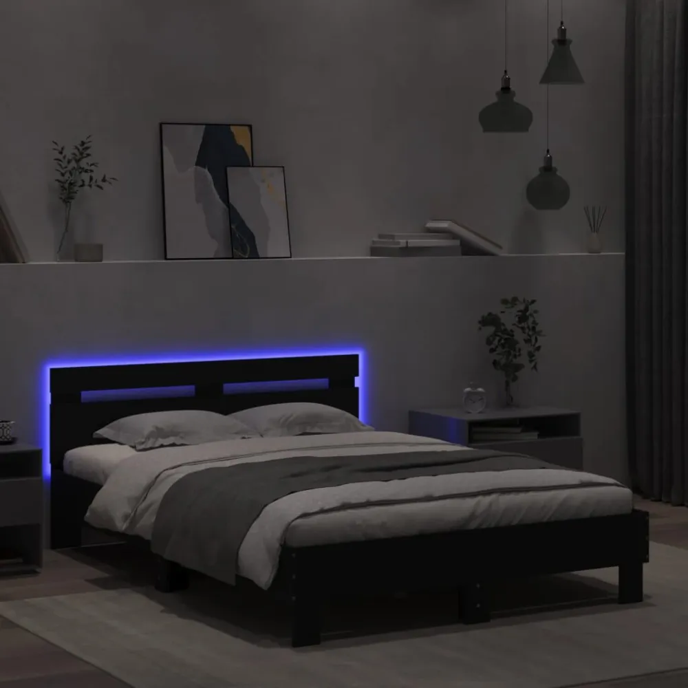 Bedframe met hoofdeinde en LED zwart 135x190 cm