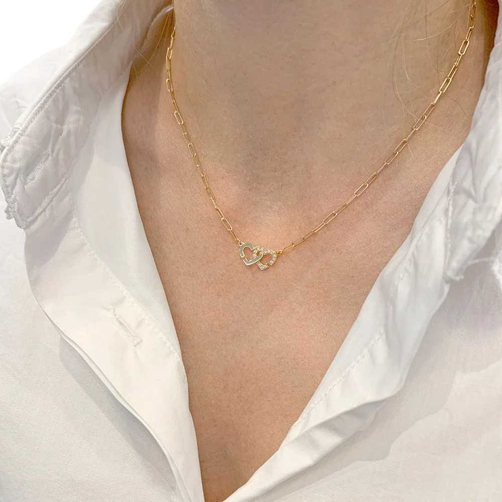 Necklace Dinh Van "Double Coeur" rose verguld, diamonds.