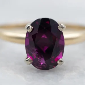 Two Tone Oval Cut Rhodolite Garnet Solitaire Ring